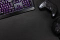 Purple lit keyboard by game controller and mouse Royalty Free Stock Photo