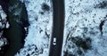 Aerial view of a mountain road covered in snow