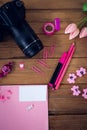 Directly abvoe shot of office supplies with camera and artificial tulip flowers Royalty Free Stock Photo