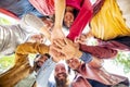 Directly below portrait of happy diverse large group of multicultural friends holding hands making high five stacking them Royalty Free Stock Photo