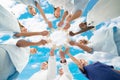 Medical Team Joining Jigsaw Pieces Against Sky Royalty Free Stock Photo