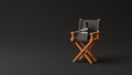 Director chair, clapperboard and megaphone on black background Royalty Free Stock Photo