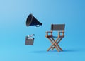 Director chair, clapperboard and megaphone on blue background Royalty Free Stock Photo