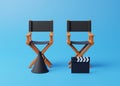 Director chair, clapperboard and megaphone on blue background Royalty Free Stock Photo