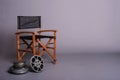 Film director's chair with movie reel Royalty Free Stock Photo