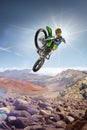 Dirt bike rider flying high on the top of vulcan Royalty Free Stock Photo