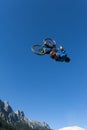 Dirt biker makes a high backflip with blue sky Royalty Free Stock Photo