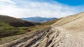 Dirt difficult road in mountainous terrain