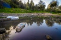 Dirt and garbage in a puddle Royalty Free Stock Photo