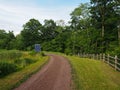 Dirt and Gravel Country Road Leading to Solar Panel Royalty Free Stock Photo