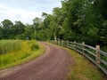 Dirt and Gravel Country Road Leading to Solar Panel Royalty Free Stock Photo