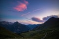 Dirt mountain road leading to high mountain pass Royalty Free Stock Photo