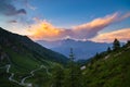 Dirt mountain road leading to high mountain pass Royalty Free Stock Photo