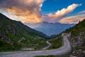 Dirt mountain road leading to high mountain pass