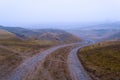 dirt muddy road wet Puddle countryside autumn fall green grass steppe after rain Tire tracks beautiful landscape Moldova Royalty Free Stock Photo