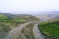 dirt muddy road wet Puddle countryside autumn fall green grass steppe after rain Tire tracks beautiful landscape Moldova Royalty Free Stock Photo