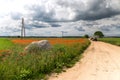 Dirt road between agricultural fields of Latvia Royalty Free Stock Photo