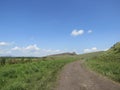 A dirt road along the hill