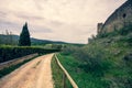 Dirt road along the medieval walls of the village of Monteriggioni