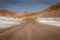 Dirt road in Atacama desert, moon valley landscape in Chile, South America Royalty Free Stock Photo