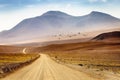 Dirt road in Atacama desert, volcanic arid landscape in Chile, South America Royalty Free Stock Photo