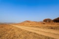 Dirt road in the autumn prairie
