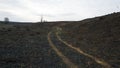 A dirt road on a burnt-out field Royalty Free Stock Photo