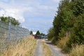 Kaisersesch, Germany - 07 26 2022: dirt road with a tractor depot
