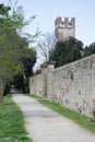 Dirt road in front of the castel walls