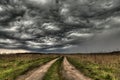 Dirt road going into the eye of the storm Royalty Free Stock Photo