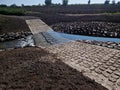 The dirt road leads across a stream that crosses river and continues Royalty Free Stock Photo