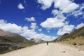 A dirt road leads to the foot of the mountain