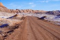 Dirt road in the Moon valley in Atacama desert near San Pedro de Atacama, Chile. Royalty Free Stock Photo