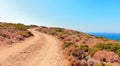 Dirt road to the shore of Mediterranean sea Royalty Free Stock Photo