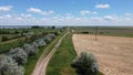 Dirt road near the river and endless fields. Summer. Beautiful Ukrainian nature Royalty Free Stock Photo