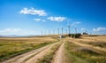 Dirt Road Passing Through Field With Windmills Royalty Free Stock Photo