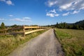 Dirt road in the Silesian Beskids, mountain landscape with path along wooden fence Royalty Free Stock Photo