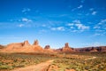 Dirt road trail through southern Utah towers of red rock Royalty Free Stock Photo