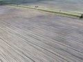 Dirt road between two plowed fields, aerial view. Agricultural land Royalty Free Stock Photo