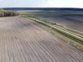 Dirt road between two plowed fields, aerial view. Agricultural land Royalty Free Stock Photo