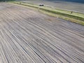 Dirt road between two plowed fields, aerial view. Agricultural land Royalty Free Stock Photo