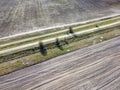Dirt road between two plowed fields, aerial view. Agricultural land Royalty Free Stock Photo