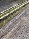 Dirt road between two plowed fields, aerial view. Agricultural land Royalty Free Stock Photo