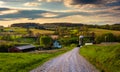 Dirt road and view of farm fields in rural York County, Pennsylvania. Royalty Free Stock Photo