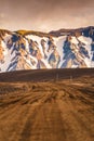 Dirt road with volcanic mountain on wilderness in rural scene Royalty Free Stock Photo