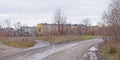 Dirtroad along old soviet apartment buildings in Paldiski, Estonia