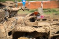 Dirty athlete helmet lying on the dirty ATV