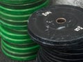 Dirty black and green disc barbell stack