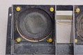 dirty black speaker on a broken electrical appliance Royalty Free Stock Photo