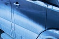 Dirty blue car door. Dry mud. Royalty Free Stock Photo